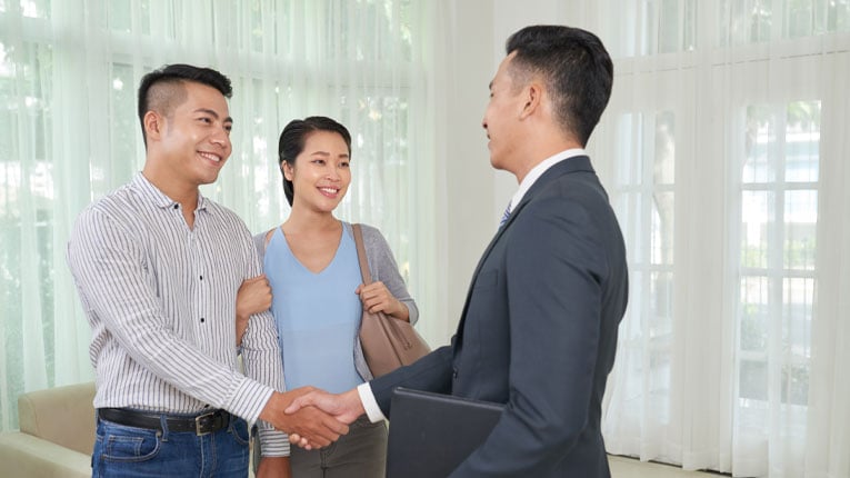 credit-union-vs-bank-which-mortgage-is-better-asian-couple-shaking-hands-in-new-house